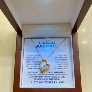 Never worn , gold Qbert zirconium heart necklace